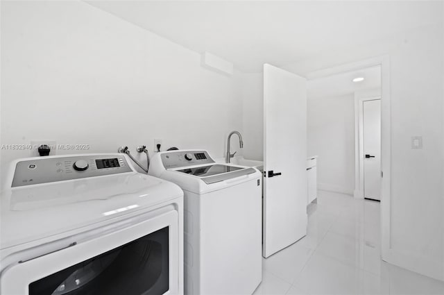 8250 SW 187th St, Cutler Bay, FL 33157 - laundry room featuring washer and dryer and light tile patterned flooring