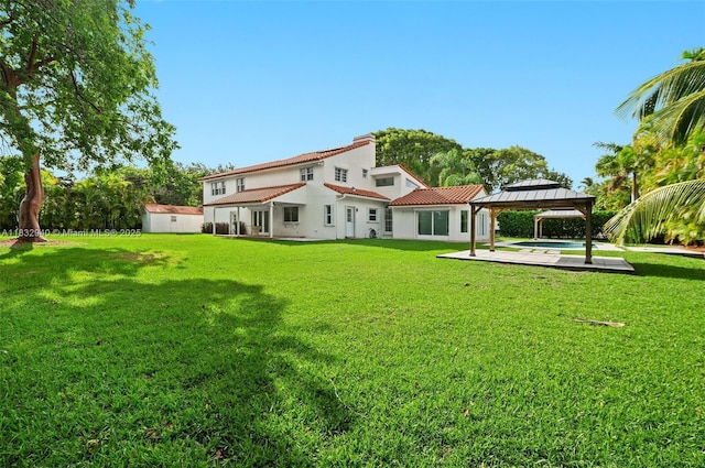 8250 SW 187th St, Cutler Bay, FL 33157 - rear view of property with a gazebo, a yard, a shed, and stucco siding