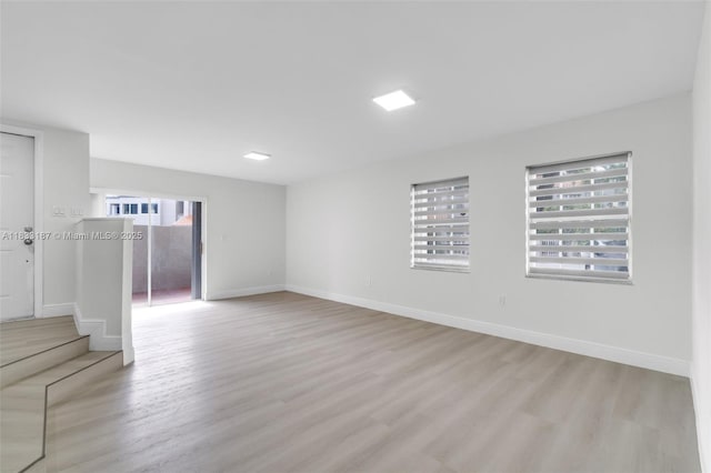 6514 SW 128th Pl Unit 6514, Miami, FL 33183 - unfurnished room with plenty of natural light, wood finished floors, and stairs