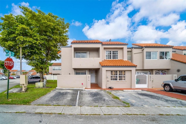 6514 SW 128th Pl Unit 6514, Miami, FL 33183 - view of front of home featuring uncovered parking, a tile roof, and stucco siding
