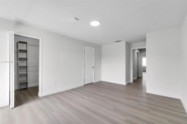 6514 SW 128th Pl Unit 6514, Miami, FL 33183 - unfurnished bedroom with light wood finished floors and a spacious closet