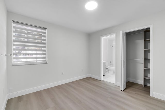 6514 SW 128th Pl Unit 6514, Miami, FL 33183 - unfurnished bedroom featuring light wood-style floors, a closet, and connected bathroom