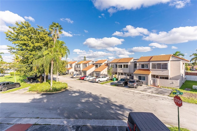 6514 SW 128th Pl Unit 6514, Miami, FL 33183 - view of asphalt street with a residential view, traffic signs, and curbs