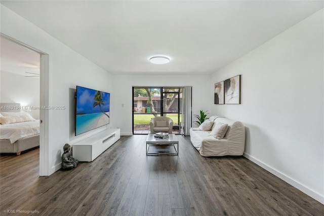 37 Seville Cir Unit 1-50, Davie, FL 33324 - living area featuring dark wood-style flooring and baseboards