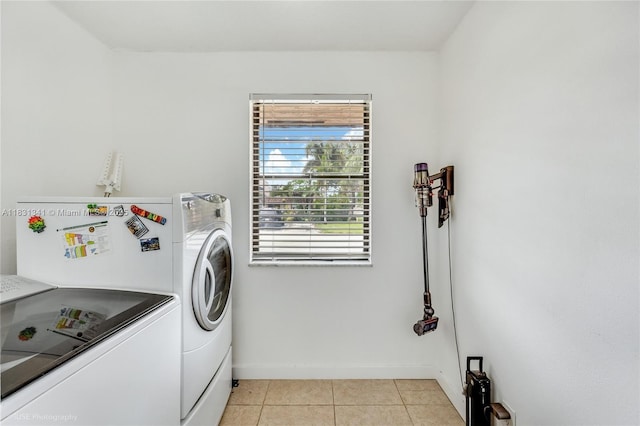 37 Seville Cir Unit 1-50, Davie, FL 33324 - laundry room with independent washer and dryer and light tile patterned floors