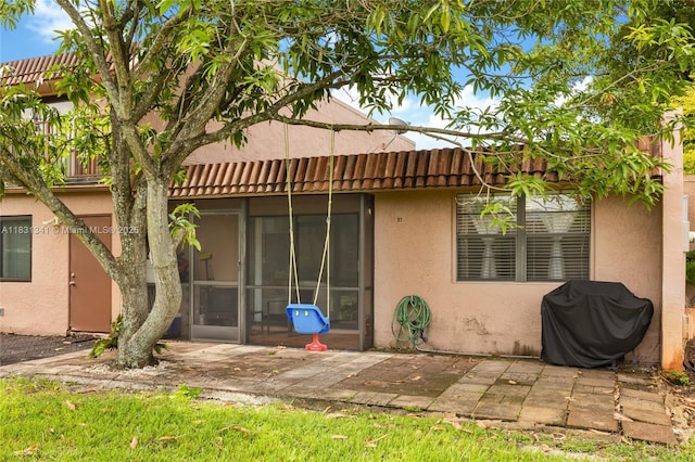 37 Seville Cir Unit 1-50, Davie, FL 33324 - rear view of property with stucco siding and a patio