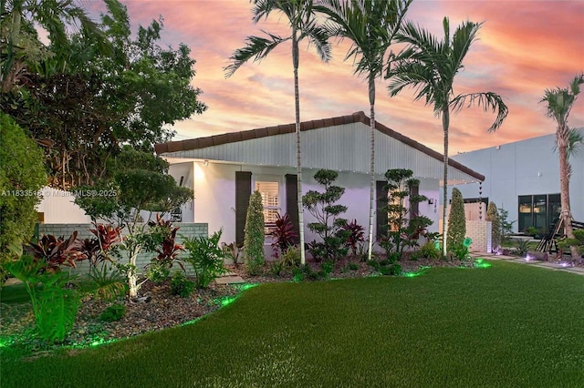 240 NE 97th St, Miami Shores, FL 33138 - back of house featuring a lawn and stucco siding