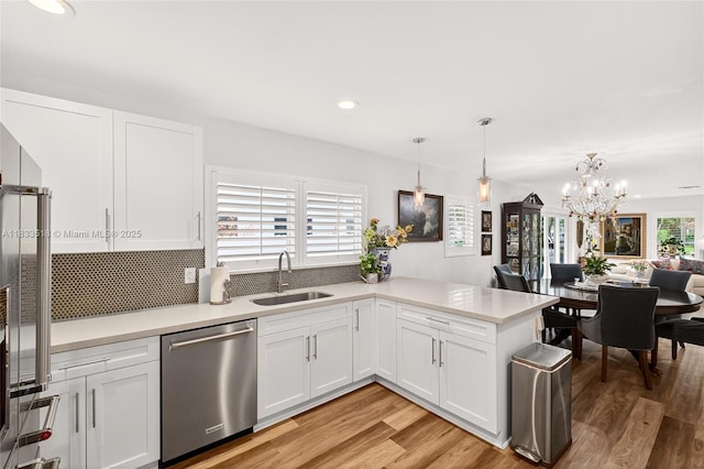 240 NE 97th St, Miami Shores, FL 33138 - kitchen featuring dishwasher, white cabinetry, light countertops, and recessed lighting