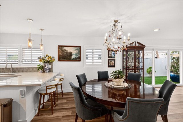 240 NE 97th St, Miami Shores, FL 33138 - dining space featuring plenty of natural light, wood finished floors, a chandelier, and recessed lighting