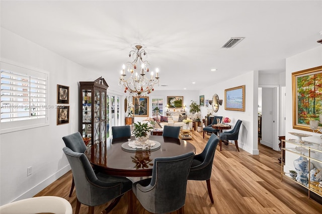 240 NE 97th St, Miami Shores, FL 33138 - dining room with a chandelier, light wood-style flooring, and recessed lighting