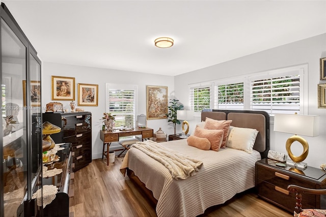 240 NE 97th St, Miami Shores, FL 33138 - bedroom featuring multiple windows, wood finished floors, and a desk
