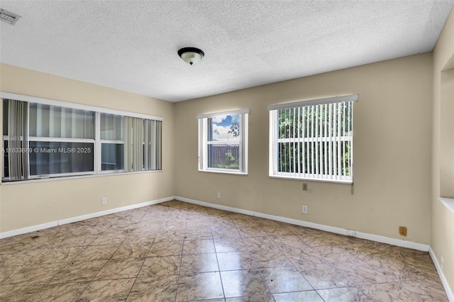 2727 Hypoluxo Rd, Boynton Beach, FL 33462 - spare room with a textured ceiling and marble finish floors