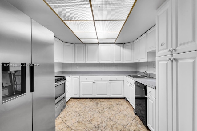 2727 Hypoluxo Rd, Boynton Beach, FL 33462 - kitchen featuring appliances with stainless steel finishes, white cabinetry, light marble finish floors, and light countertops