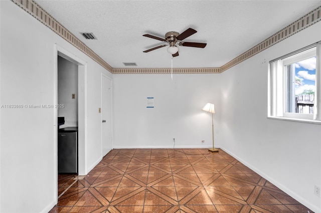 2727 Hypoluxo Rd, Boynton Beach, FL 33462 - empty room with a ceiling fan and a textured ceiling