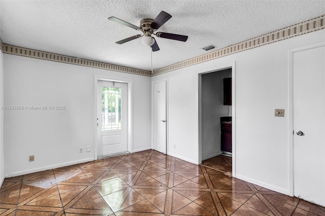 2727 Hypoluxo Rd, Boynton Beach, FL 33462 - spare room featuring a textured ceiling and ceiling fan