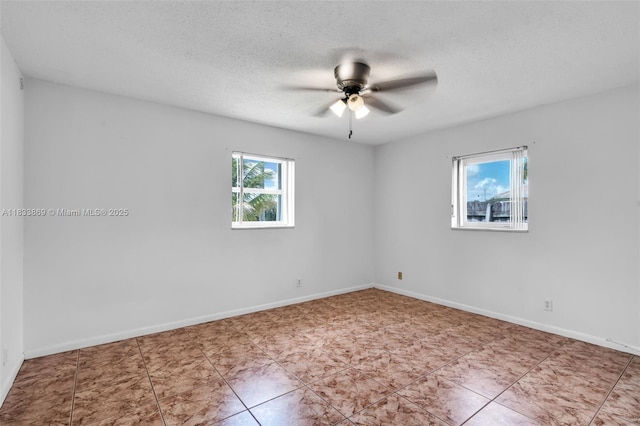 2727 Hypoluxo Rd, Boynton Beach, FL 33462 - empty room featuring a ceiling fan and a textured ceiling