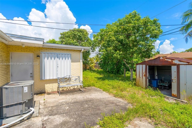 2727 Hypoluxo Rd, Boynton Beach, FL 33462 - view of patio / terrace featuring a shed