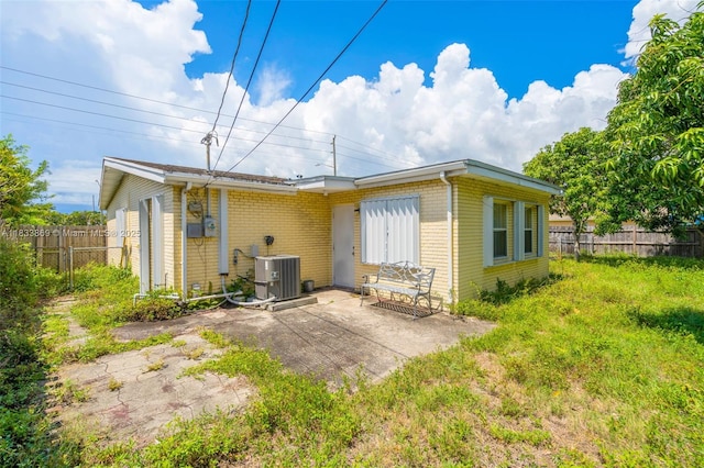 2727 Hypoluxo Rd, Boynton Beach, FL 33462 - back of house featuring brick siding and a patio area