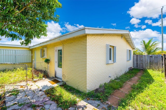 2727 Hypoluxo Rd, Boynton Beach, FL 33462 - view of side of property with brick siding