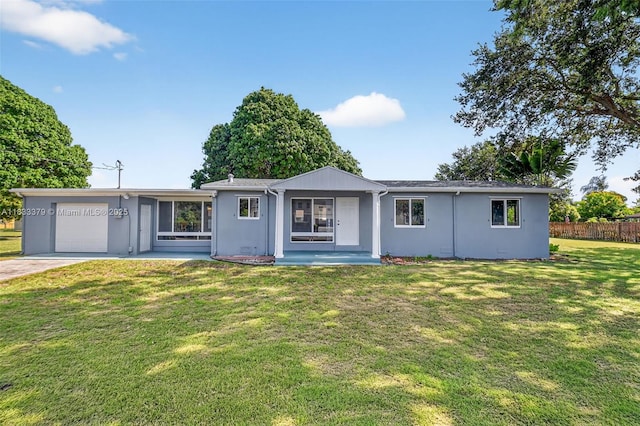 4061 Nova Ln, Lake Worth, FL 33462 - ranch-style house with a garage, stucco siding, and driveway