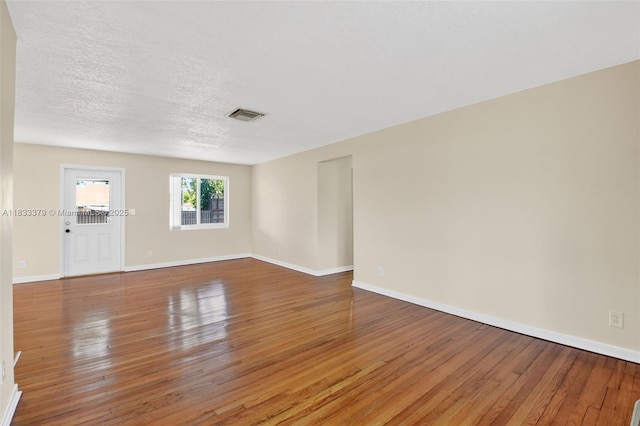 4061 Nova Ln, Lake Worth, FL 33462 - spare room featuring wood-type flooring and a textured ceiling