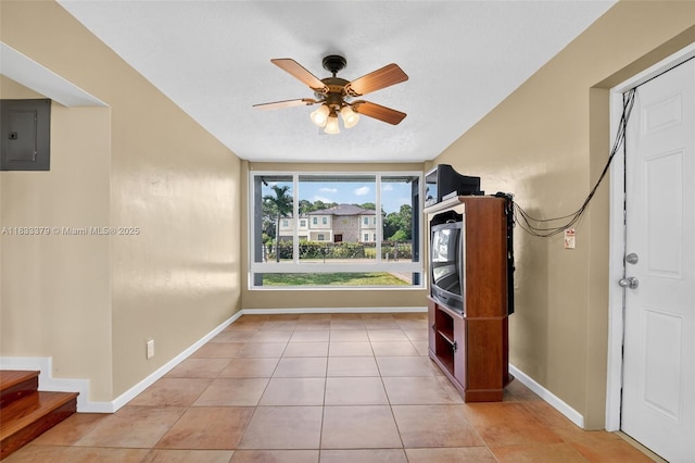 4061 Nova Ln, Lake Worth, FL 33462 - entrance foyer featuring electric panel, ceiling fan, light tile patterned floors, and stairway