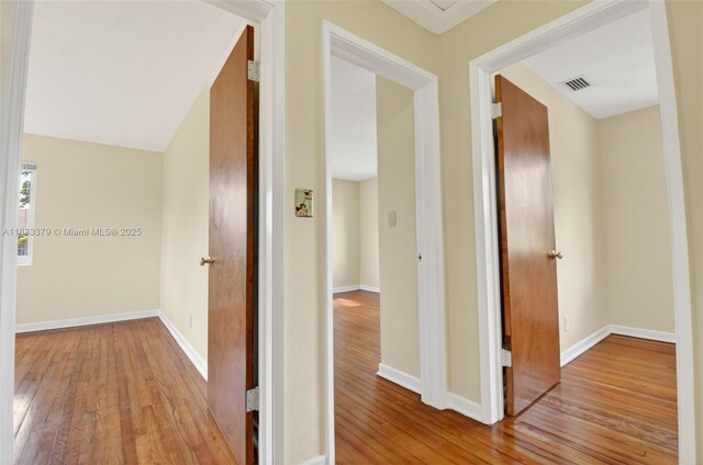 4061 Nova Ln, Lake Worth, FL 33462 - hallway featuring hardwood / wood-style flooring and baseboards