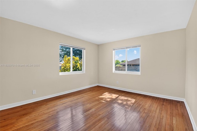 4061 Nova Ln, Lake Worth, FL 33462 - unfurnished room featuring baseboards and hardwood / wood-style floors