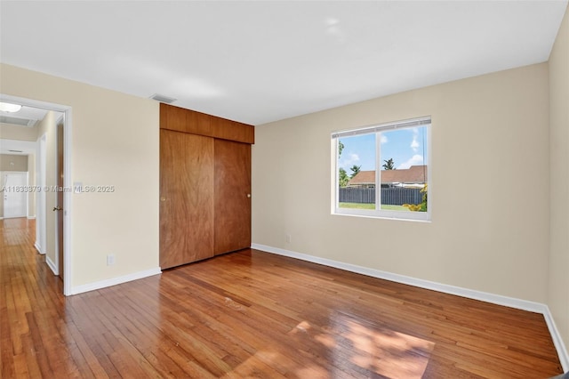 4061 Nova Ln, Lake Worth, FL 33462 - unfurnished bedroom with hardwood / wood-style flooring and a closet