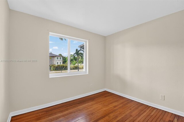 4061 Nova Ln, Lake Worth, FL 33462 - empty room featuring baseboards and hardwood / wood-style floors