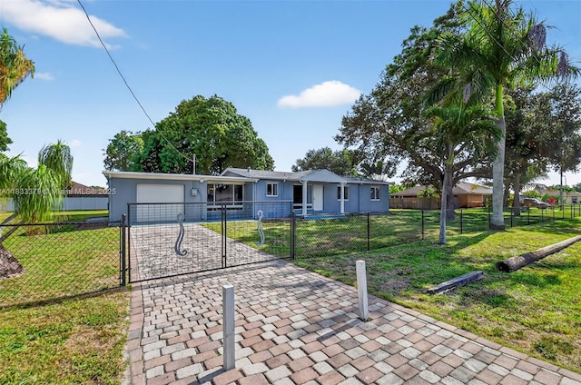 4061 Nova Ln, Lake Worth, FL 33462 - ranch-style home with a garage, decorative driveway, a fenced front yard, stucco siding, and a gate