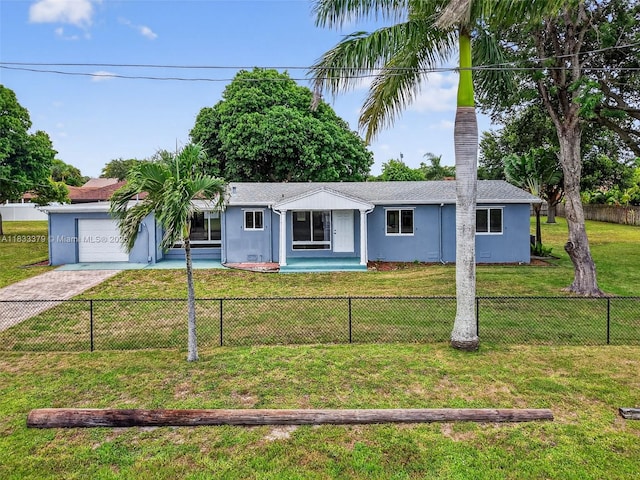 4061 Nova Ln, Lake Worth, FL 33462 - ranch-style home featuring driveway, a fenced front yard, a garage, and stucco siding