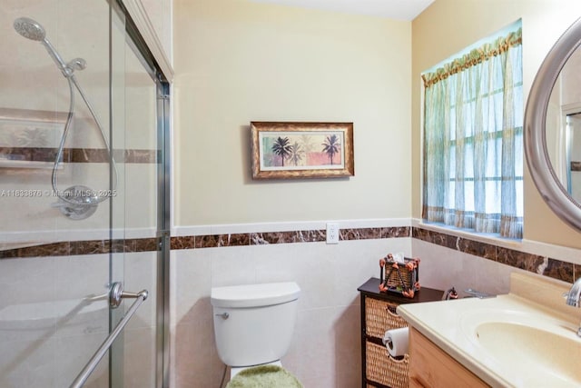 841 Meadowlark Ln, Delray Beach, FL 33445 - bathroom featuring vanity, a tile shower, tile walls, and wainscoting