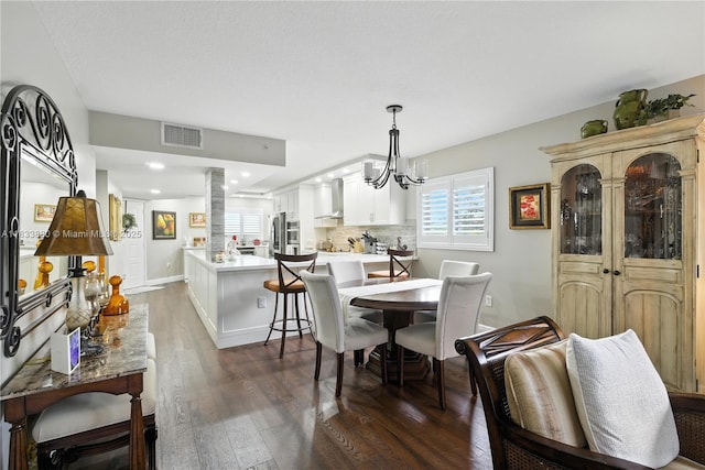 1651 SW 127th Ave Unit 301A, Pembroke Pines, FL 33027 - dining space with dark wood finished floors, a chandelier, and recessed lighting