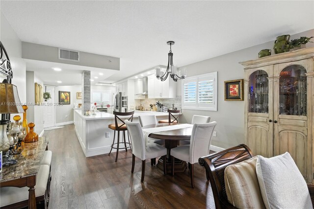 1651 SW 127th Ave Unit 301A, Pembroke Pines, FL 33027 - dining area with wood finished floors and a chandelier