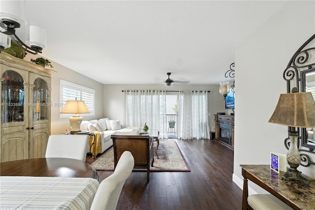 1651 SW 127th Ave Unit 301A, Pembroke Pines, FL 33027 - living area featuring dark wood finished floors, a ceiling fan, and a fireplace