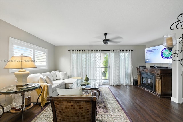 1651 SW 127th Ave Unit 301A, Pembroke Pines, FL 33027 - living area featuring dark wood-style floors, ceiling fan, and a glass covered fireplace