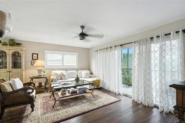 1651 SW 127th Ave Unit 301A, Pembroke Pines, FL 33027 - living area featuring healthy amount of natural light, a ceiling fan, and dark wood-style flooring