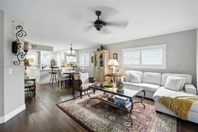 1651 SW 127th Ave Unit 301A, Pembroke Pines, FL 33027 - living room with a ceiling fan, dark wood finished floors, and a chandelier