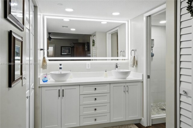 1651 SW 127th Ave Unit 301A, Pembroke Pines, FL 33027 - bathroom with double vanity, a shower stall, and recessed lighting