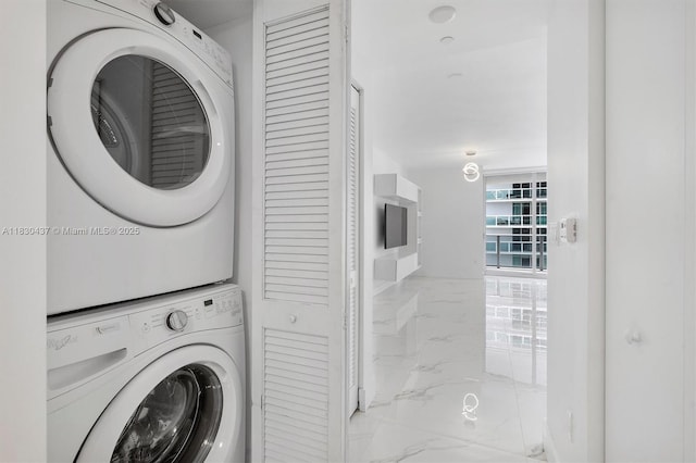488 NE 18th St Unit 1503, Miami, FL 33132 - washroom featuring marble finish floors and stacked washing machine and dryer