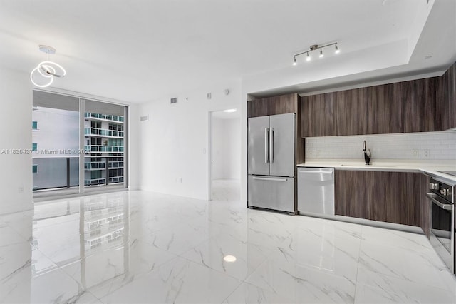 488 NE 18th St Unit 1503, Miami, FL 33132 - kitchen featuring appliances with stainless steel finishes, modern cabinets, and dark brown cabinets