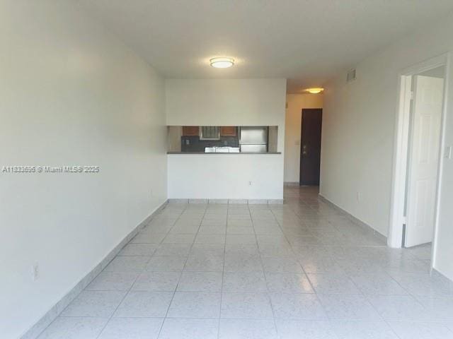3181 SW 13th St Unit 307, Miami, FL 33145 - empty room with light tile patterned floors