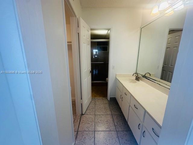 3181 SW 13th St Unit 307, Miami, FL 33145 - full bathroom with vanity and tile patterned flooring