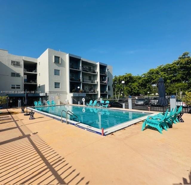 3181 SW 13th St Unit 307, Miami, FL 33145 - community pool featuring a patio area