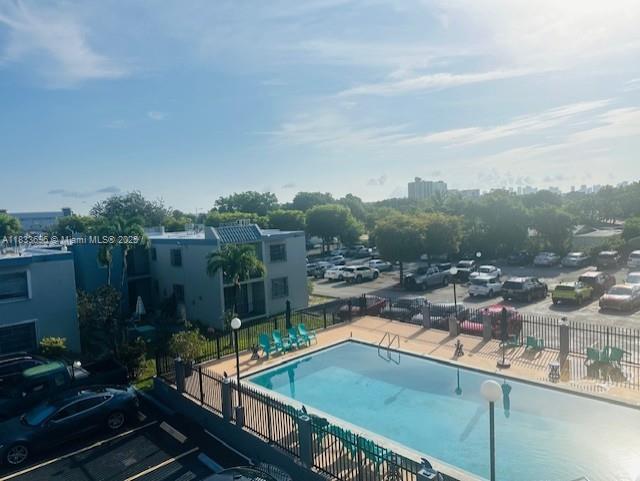 3181 SW 13th St Unit 307, Miami, FL 33145 - community pool featuring a patio