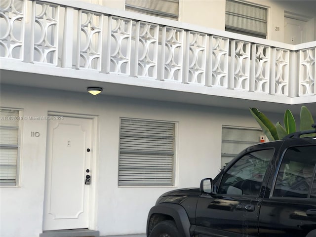 1860 Venice Park Dr Unit 110, North Miami, FL 33181 - doorway to property featuring stucco siding