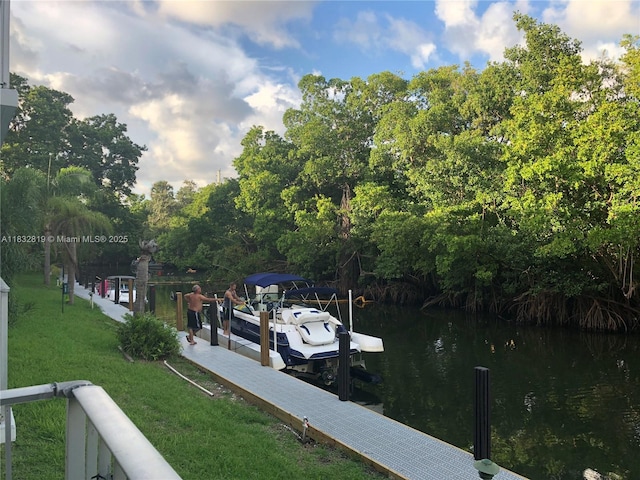 1860 Venice Park Dr Unit 110, North Miami, FL 33181 - dock area featuring a water view and a yard