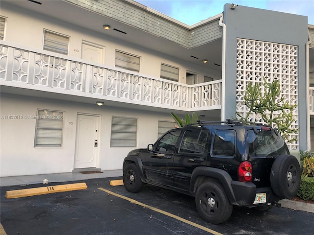 1860 Venice Park Dr Unit 110, North Miami, FL 33181 - view of property featuring uncovered parking
