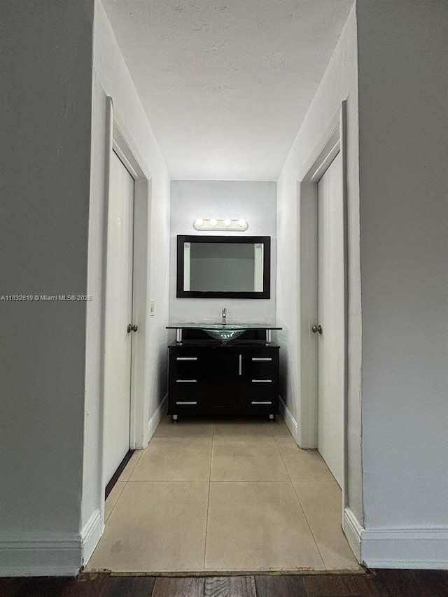 1860 Venice Park Dr Unit 110, North Miami, FL 33181 - bathroom with vanity and tile patterned floors